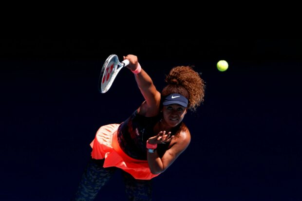 Naomi Osaka focused on hitting a tennis ball in a professional match, 2K Desktop Wallpaper