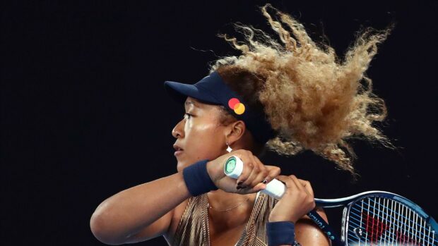 Naomi Osaka prepares to hit a backhand shot during a match, 2K Desktop Wallpaper