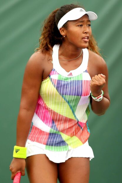 Naomi Osaka confident during a match showing determination, HD Mobile Wallpaper