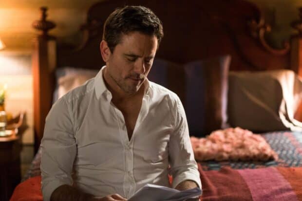 A man in a white shirt reads a letter in a warmly lit room from Nashville Tv Series Wallpapers, HD Desktop Wallpaper