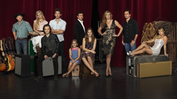 The Nashville Tv Series cast stands and sits in front of red curtains with musical instruments around, HD Desktop Wallpaper