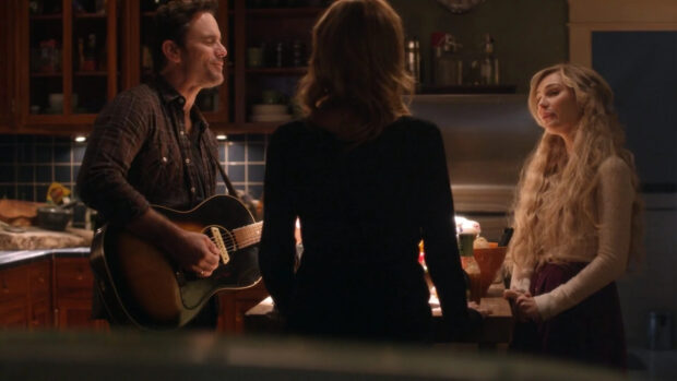A man plays guitar while two women listen in a cozy kitchen setting from Nashville Tv Series, HD Desktop Wallpaper