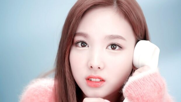 A close up of Nayeon looking directly at the camera with a soft expression, HD Desktop Wallpaper
