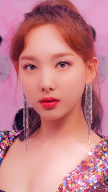 A close up portrait of Nayeon with sparkling earrings and colorful outfit, 4K Phone Wallpaper