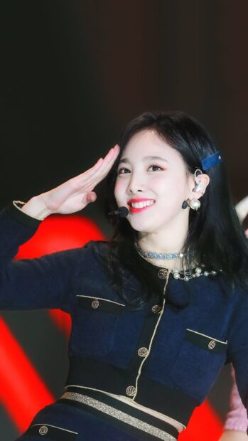 Nayeon Wallpapers featuring her smiling and saluting during a stage performance, HD Mobile Wallpaper