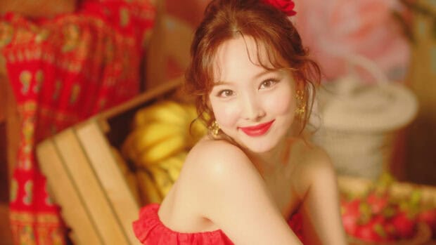 Nayeon wallpapers showing a cheerful woman in a bright red dress with a warm background, 2K Desktop Wallpaper