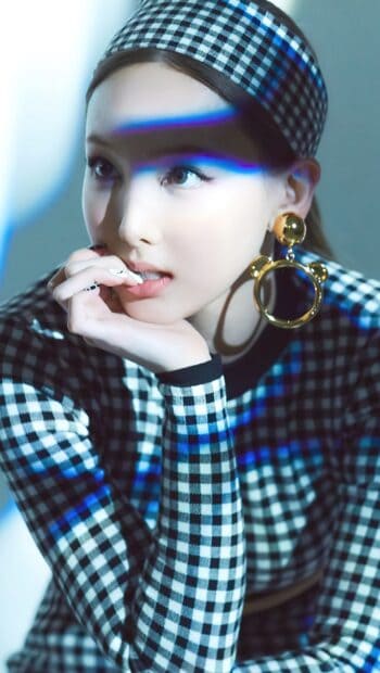 Nayeon Wallpapers showing thoughtful expression with hand near mouth, HD Mobile Wallpaper
