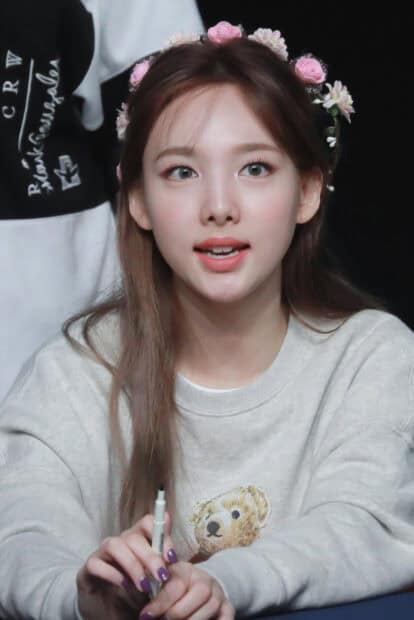 A close up of Nayeon with a flower crown holding a pen, HD Phone Wallpaper