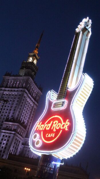 The Hard Rock logo shines brightly on a giant guitar sign at night, HD Mobile Wallpaper
