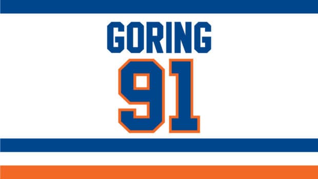 The image shows the New York Islanders Goring jersey with number 91 in team colors, 2K Desktop Wallpaper