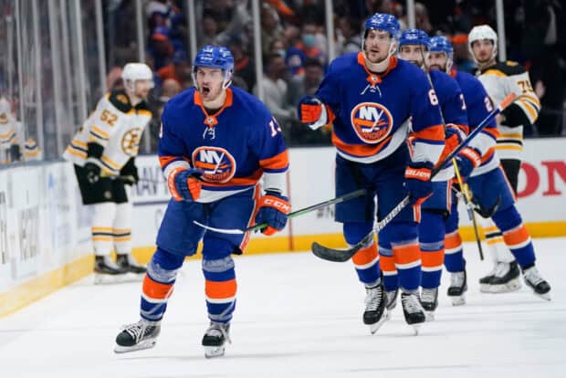 New York Islanders players are celebrating a goal during the hockey game, HD Desktop Wallpaper