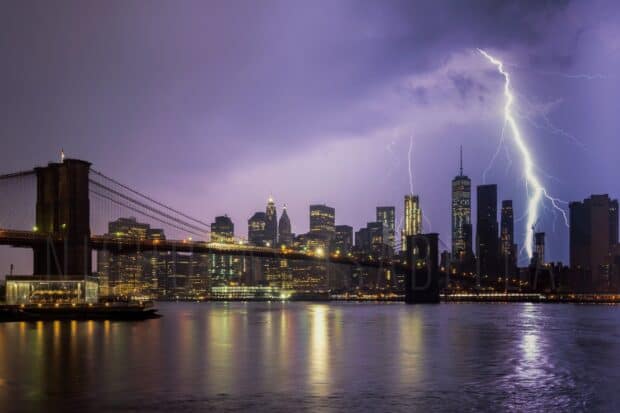A lightning strike illuminates the New York skyline at night with reflections on the water, HD Desktop Wallpaper