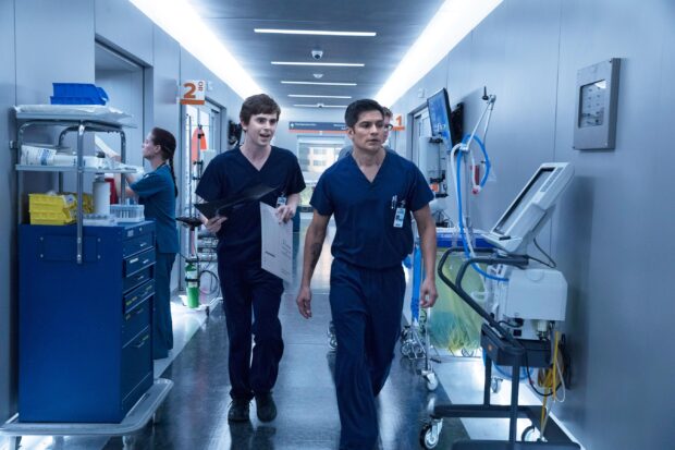 Nicholas Gonzalez walks through a hospital hallway wearing medical scrubs with a colleague, 2K Desktop Wallpaper
