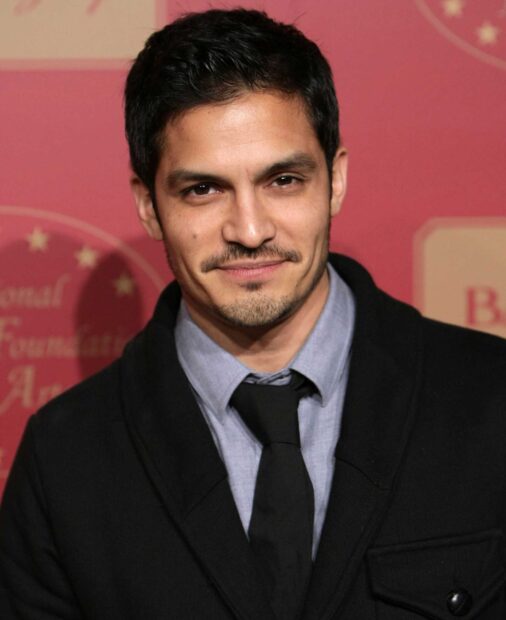 Nicholas Gonzalez wallpapers show him wearing a black jacket and tie with a confident smile, HD Desktop Wallpaper