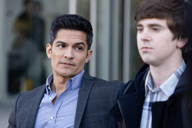 Nicholas Gonzalez has a serious conversation with a young man outside a building, HD Desktop Wallpaper