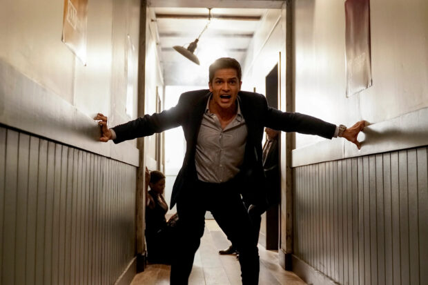 Nicholas Gonzalez is shouting with intense expression in a narrow hallway, 2K Desktop Wallpaper