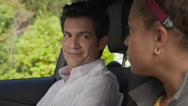 Nicholas Gonzalez is seen smiling and looking at a woman inside a car during the daytime, 2K Desktop Wallpaper