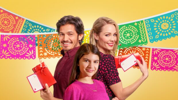 A happy family with Nicholas Gonzalez smiling and holding gifts in a colorful festive scene, 4K Desktop Wallpaper