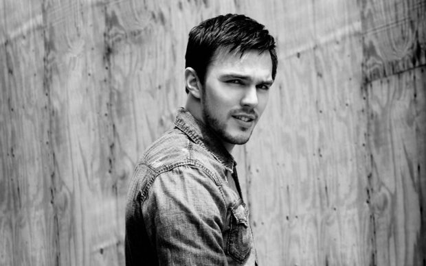 Nicholas Hoult poses in a denim jacket against a wooden backdrop, HD Desktop Wallpaper