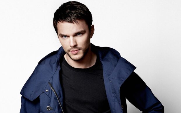 Nicholas Hoult is wearing a navy jacket and black shirt with a serious expression, HD Desktop Wallpaper