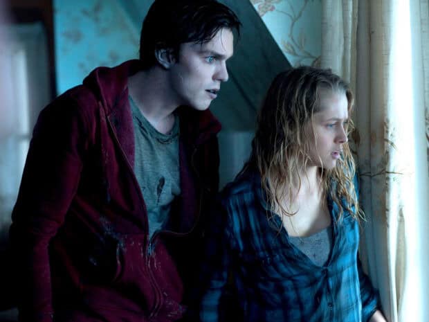 Nicholas Hoult stands with a woman looking anxiously out of a window in a dim room, HD Desktop Wallpaper