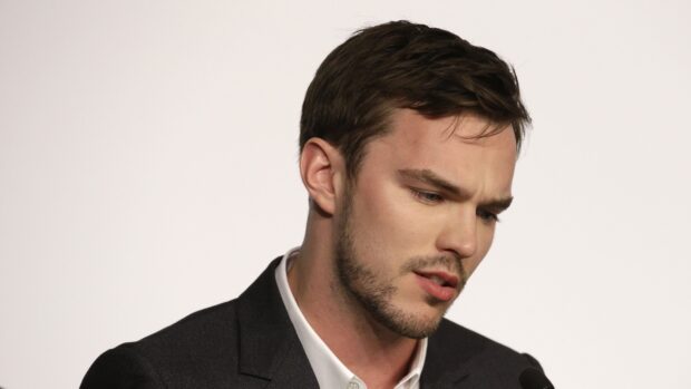 A close up of Nicholas Hoult looking serious and thoughtful, 4K Desktop Wallpaper