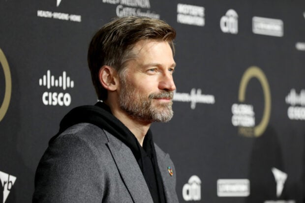 Nikolaj Coster Waldau is seen smiling at a formal event with a dark backdrop, 2K Desktop Wallpaper