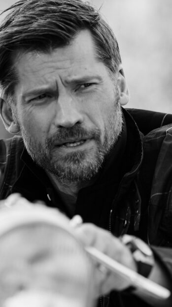 A focused man with a beard looks intently in a black and white portrait of Nikolaj Coster Waldau, 2K Phone Wallpaper
