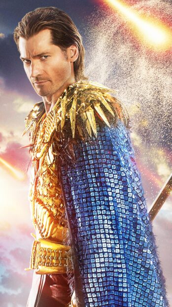 Nikolaj Coster Waldau is wearing detailed golden armor with a blue cape in a dramatic scene, 4K Phone Wallpaper