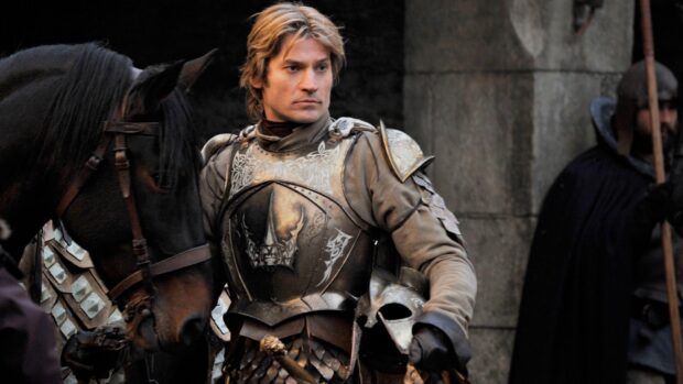 Nikolaj Coster Waldau stands next to a black horse wearing detailed armor and holding a helmet, HD Desktop Wallpaper