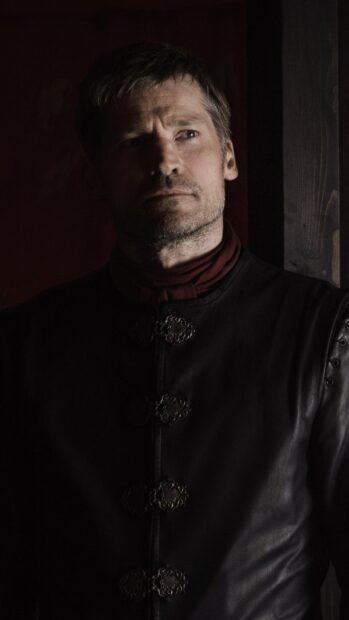 Nikolaj Coster Waldau wears a dark leather coat with ornate buttons in soft lighting, HD Phone Wallpaper