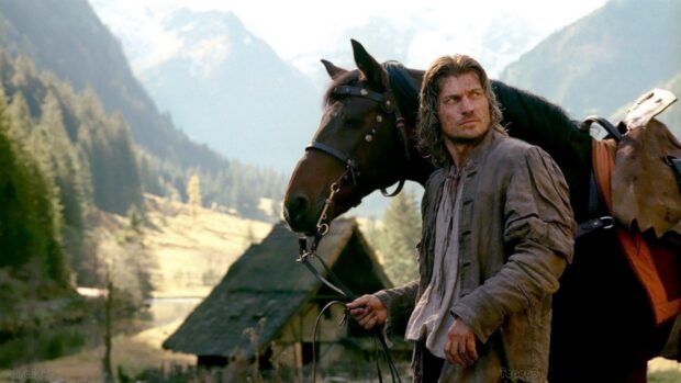Nikolaj Coster Waldau stands with a horse in a mountain village, HD Desktop Wallpaper