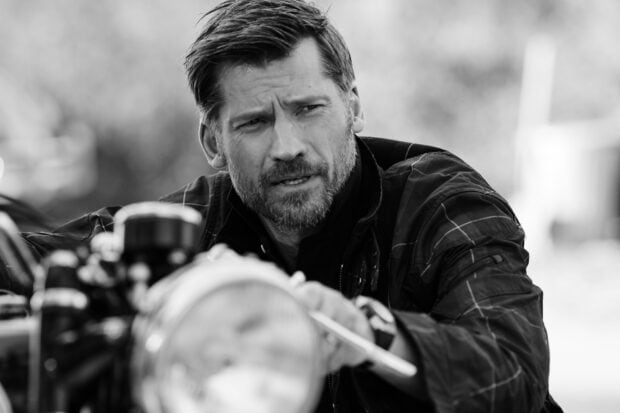 Nikolaj Coster Waldau is shown in a close up as he focuses on a motorcycle part, HD Desktop Wallpaper