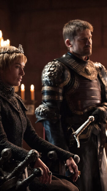 Nikolaj Coster Waldau standing beside a seated woman in an ornate medieval room, HD Mobile Wallpaper