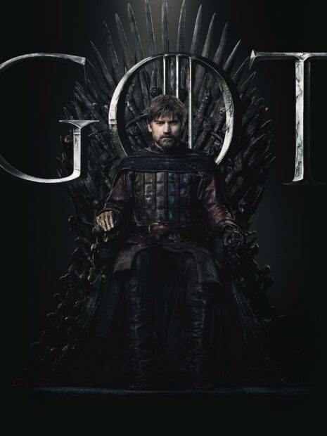 Nikolaj Coster Waldau sits confidently on the Iron Throne in dark medieval armor, 2K Desktop Wallpaper