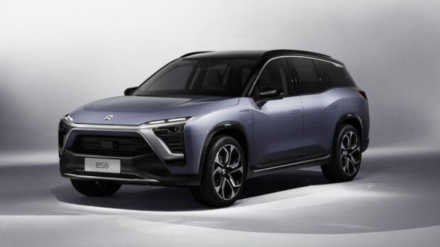 A Nio Auto ES8 electric SUV is shown in a studio with a gray background, HD Desktop Wallpaper