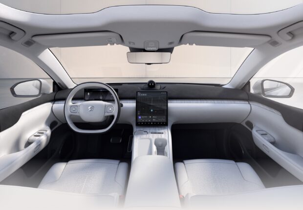 The image shows the modern car interior of Nio Auto with advanced digital displays and sleek design, 2K Desktop Wallpaper