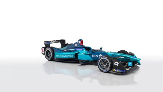 A Nio Auto racing car is shown in a modern studio setting with clear details of its aerodynamic shape, HD Desktop Wallpaper