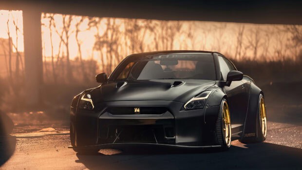 A black Nissan GT R is parked outdoors with golden sunset lighting enhancing its sleek design, 4K Desktop Wallpaper