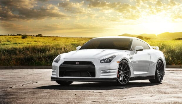 Nissan GT R parked on a scenic concrete path with golden sky, HD Desktop Wallpaper