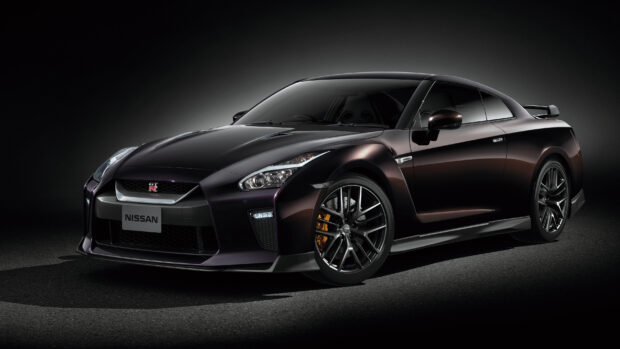 A sleek black Nissan GT R is shown in high detail and sharp focus, 2K Desktop Wallpaper