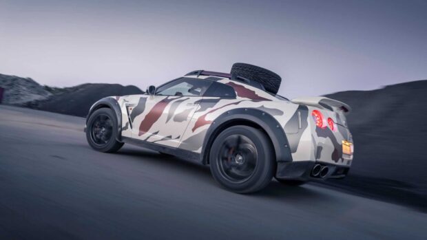 A Nissan GT R with a custom camouflage paint drives on a winding road near hills, HD Desktop Wallpaper