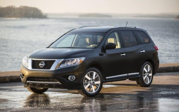 A black Nissan Pathfinder SUV parked near the water under soft natural light, HD Desktop Wallpaper