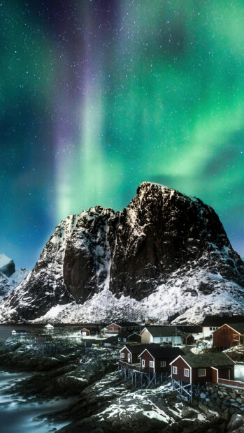 The Norway wallpapers show northern lights over snow capped mountains and a small fishing village, 4K Mobile Wallpaper