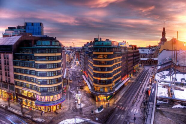 A vibrant Norway cityscape with sunset sky and snowy streets, HD Desktop Wallpaper