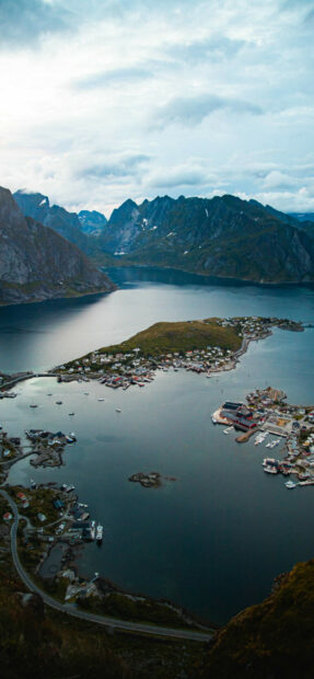 Norway Wallpapers showing a coastal village with fjords and mountains in Norway, 2K Mobile Wallpaper