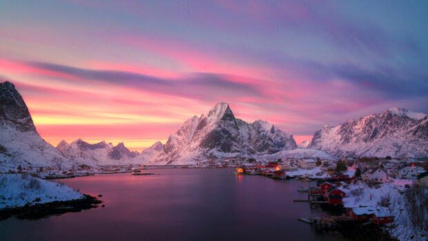 A peaceful mountain village in Norway is glowing under a colorful sunset sky, 4K Desktop Wallpaper