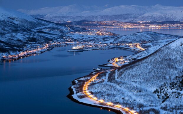 A snowy coastal town in Norway is illuminated by street lights along the winding shoreline, Norway Wallpapers, HD Desktop Wallpaper