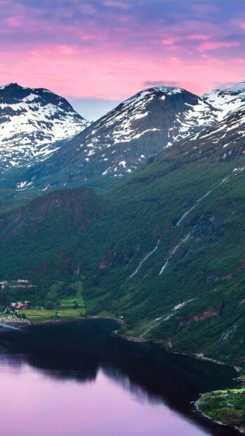 The Norwegian fjords show stunning mountains with snow under a pink sunset sky, HD Mobile Wallpaper