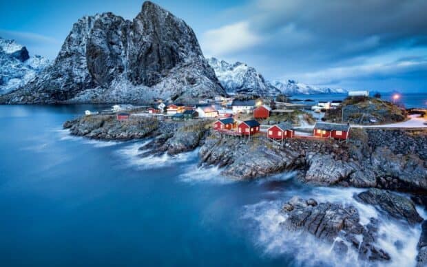 A scenic view of Norwegian fjords with colorful houses and snowy mountains, HD Desktop Wallpaper